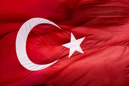 Flag of Turkey waving in the wind with highly detailed fabric textureの写真素材