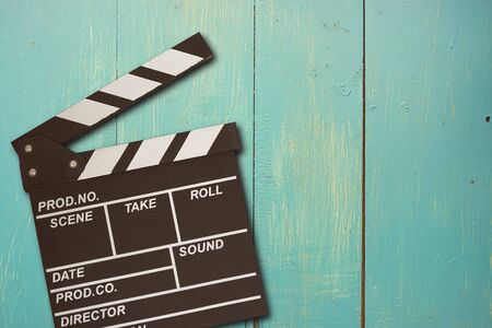 vintage photo of movie clapper on green woodの写真素材