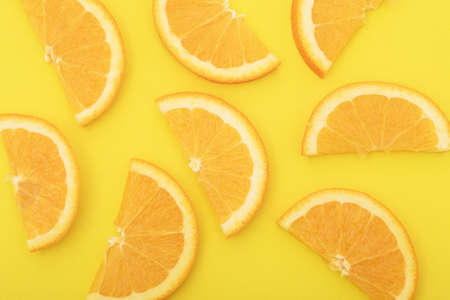 Orange slice isolated on orange background.の写真素材