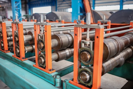 Huge machinery in factory for manufacturing metal works.