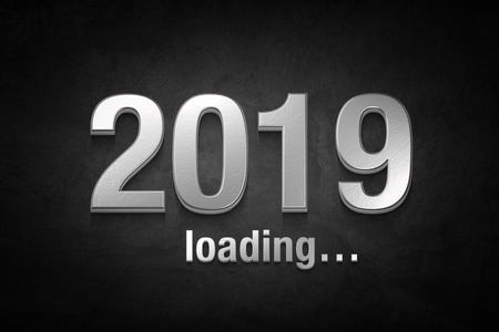 silver text of 2019 on black concrete wall.New year concept.