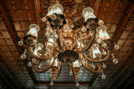 old vintage chandelier lamp on the ceiling in Dining room.の写真素材