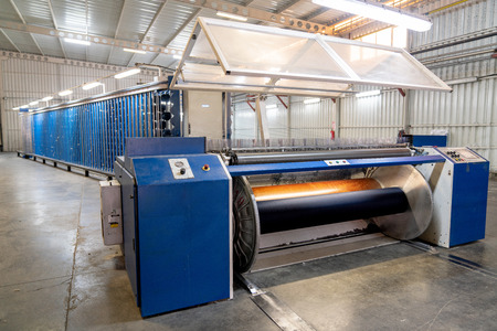 Interior of Textile factory with automated machinery.Concept of Industry and Technologyの写真素材