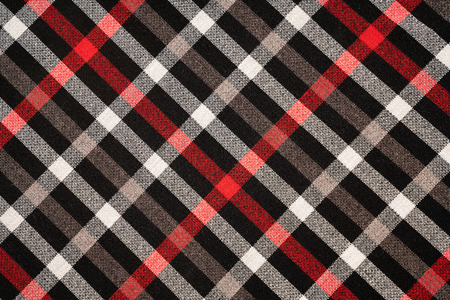 Tartan plaid natural cotton fabric. Seamless tiles texture for the background.