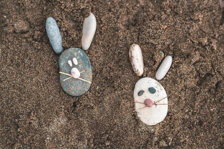 Shape of mice from stones on the beach sandの写真素材