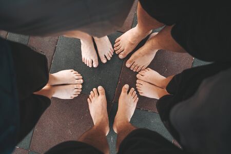 barefoot, feet on park floor, adult and child, familyの写真素材