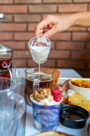 A tasty coffee with milk in breakfast for an energetic day.の写真素材