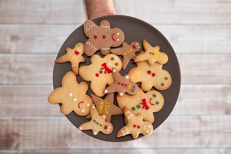 Serving traditional gingerbread cookies for new year celebration.