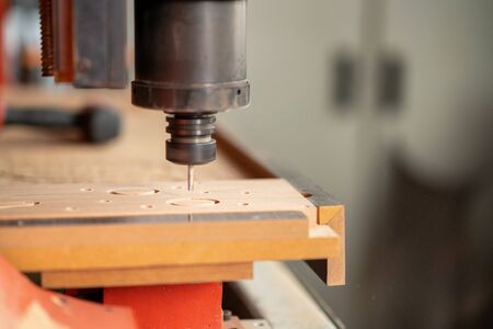 CNC Lathe machine working on wood to lathe and shaping.の写真素材