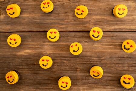 many delicious cupcakes on a wooden background with aline.の写真素材