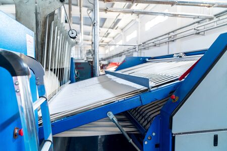 Industrial washed laundry perssing for big amount of textiles.