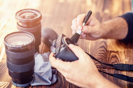 Preparing and cleaning set of photography equipments for shoting pictures.