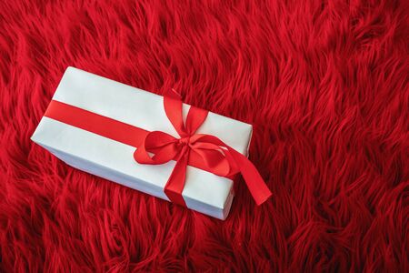 Gift box wrapped in diffrent color paper with ribbon bow.の写真素材