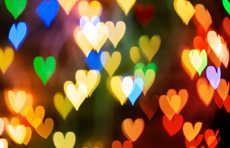 Abstract, defocused and colored heart shaped Bokeh led lights background. Overlay and banner concept