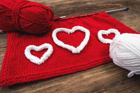 Heart Shapes on knitting with needlework. Valentines day conceptの写真素材