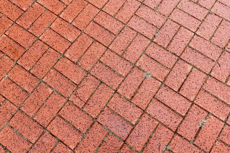 Brown cobble stone walkway get wet cause of rain. Pavement textureの写真素材
