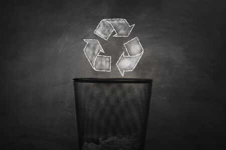 shape of the symbol of recycling on chalkboard. Protection nature and future concept