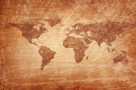 Old map of the world on a old wooden parchment background. Vintage style.