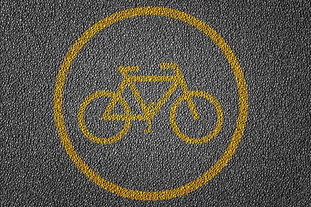 3D Illustration of a biking path area restriction for bicycle riders with yellow lines pattern and background, textured traffic rules conceptの写真素材