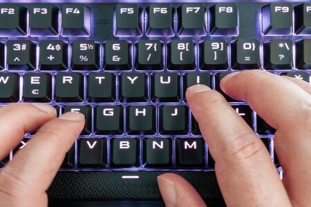 Closeup view of a keyboard with bright led lights for easy and comfortable using pc or notebook....
