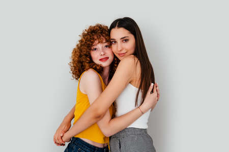 Two females hugging eachother. Relationship between friends or lovers. . High quality photoの写真素材