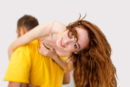 A couple loves eachother and having fun together. Man carrying the woman on his back. High quality photoの写真素材