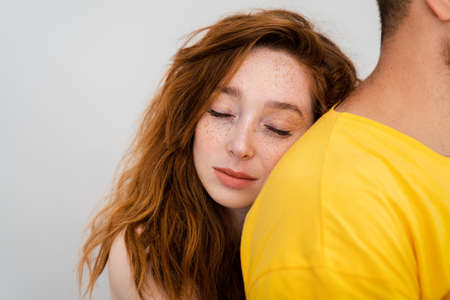 A couple loves eachother and woman lays her head to mans shoulder. . High quality photoの写真素材