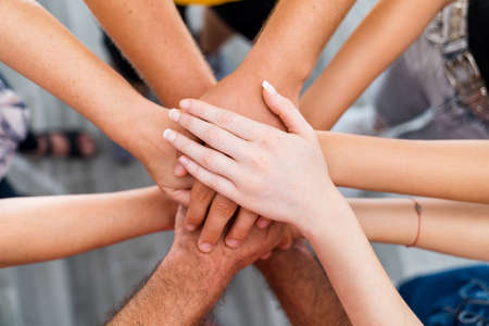 Hands of a group people who make teamwork for success to achievement . High quality photo