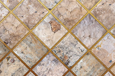 Old, faded and cracked wall collage with golden frames. Concrete, cement and golden wall pattern. Symmetric and abstract broken on textured Backgroundの写真素材