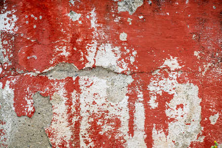 Gray and red stained cracked stucco, concrete and cement wall pattern. Asymmetric and abstract broken on textured Background. High quality photoの写真素材