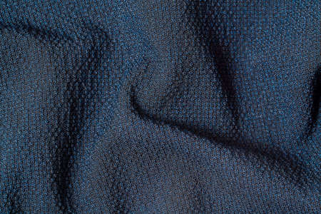Macro Photo of dark blue fabric texture background. Pattern of dark woven clothing material. High...