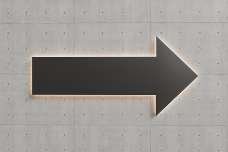 Black arrow with led light on the concrete wall. High quality photoの写真素材