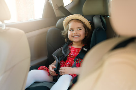 Cute little baby child sitting in car seat. Portrait of cute little baby child sitting in car...