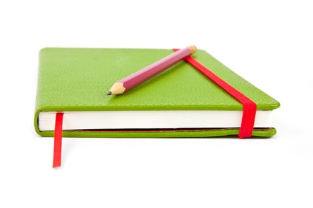 Notebook and pencil on white backgroundの写真素材