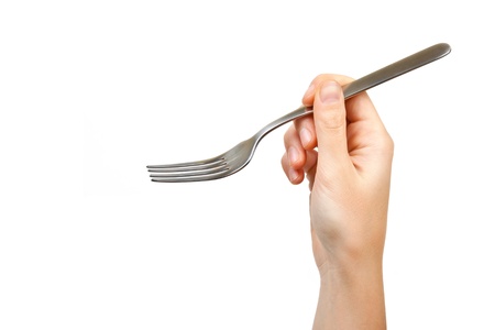 fork in hand isolated on a white backgroundの写真素材