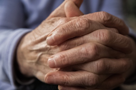 Elderly woman's hands suffering from articular disease