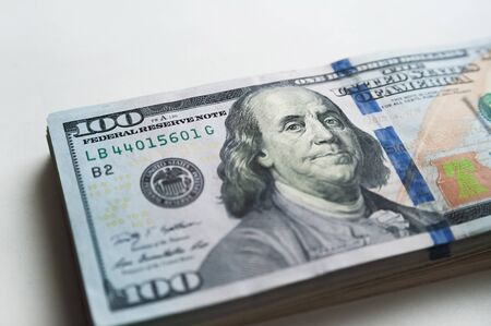 Russian rubles and American dollars. Money on a white background. Money on the texture of a tree. Money, crisis, salary, sale, purchaseの写真素材