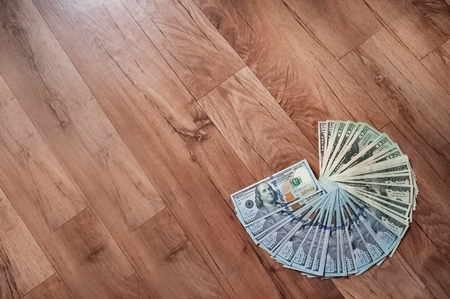 Russian rubles and American dollars. Money on a white background. Money on the texture of a tree. Money, crisis, salary, sale, purchaseの写真素材