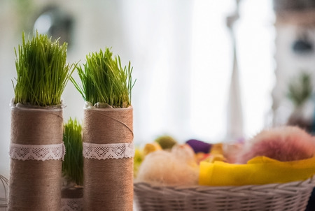 The loft-house is decorated for Easter. Easter decor home. Festive mood in a beautiful house with greenery, colorful eggs, garland.の写真素材