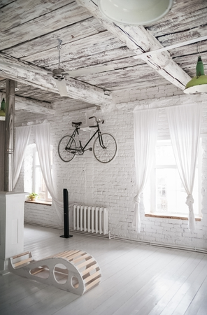 Old white bicycle whist on a white stone wall. Details of the old bicycle.の写真素材
