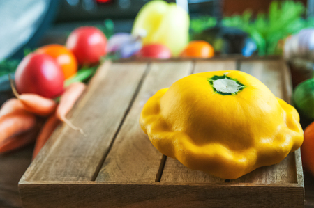 Beautiful picture of vegetables. Focus on the young squash squash. Carrots, tomatoes, cucumbers, eggplants, patissons on the background of a stylish kitchen. Natural texture of vegetables. Backgroundの写真素材