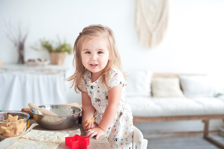 Little girl cooking, concept of love and family well-beingの写真素材