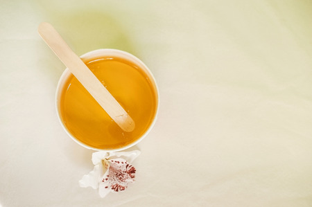 The concept of aesthetic health. Bank with sugaring, spatulas for depilation, disposable glovesの写真素材