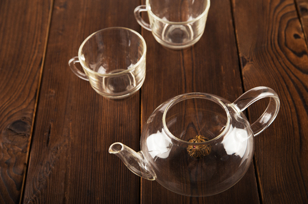 Chinese flower bound tea in a transparent teapot. Concept of tea ceremony with teapot disclosure and copy space.の写真素材
