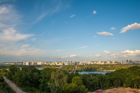 View of the city of Kiev, the Dnieper River. City panorama with a place across the river, park,...