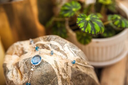 Bracelets made of natural stones on textured stones. The mysticism of amulets. Esoterics in handmade...