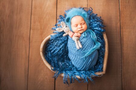 Funny newborn. Spring photograph of a Newborn baby close-up and copy space.の写真素材