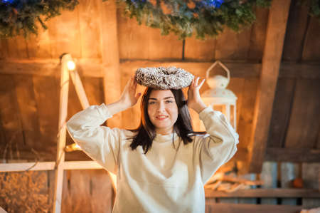 Woman at home for New Years or Christmas in the bedroom. Selective focus.の写真素材