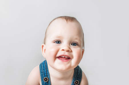 Close-up of child laughing. Toddler, teething, daily routine of baby up to year concept.の写真素材