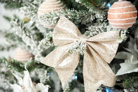 Christmas background with tree and balls, garland in defocus. New year card and copy space....